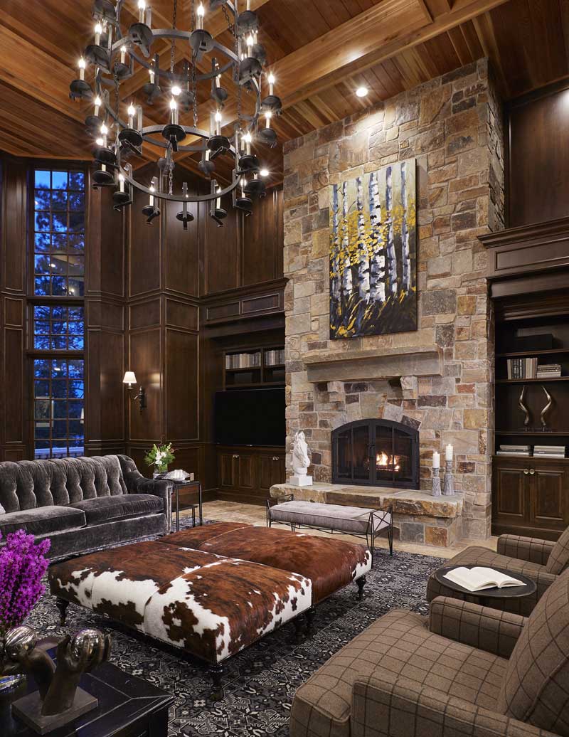 living room with 3 tier candle chandelier