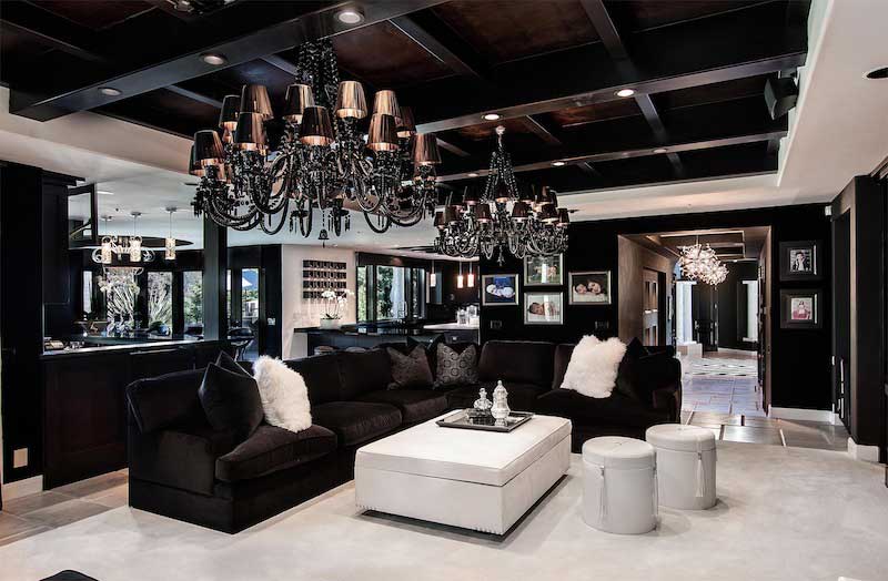 black living room with contemporary black chandelier lighting