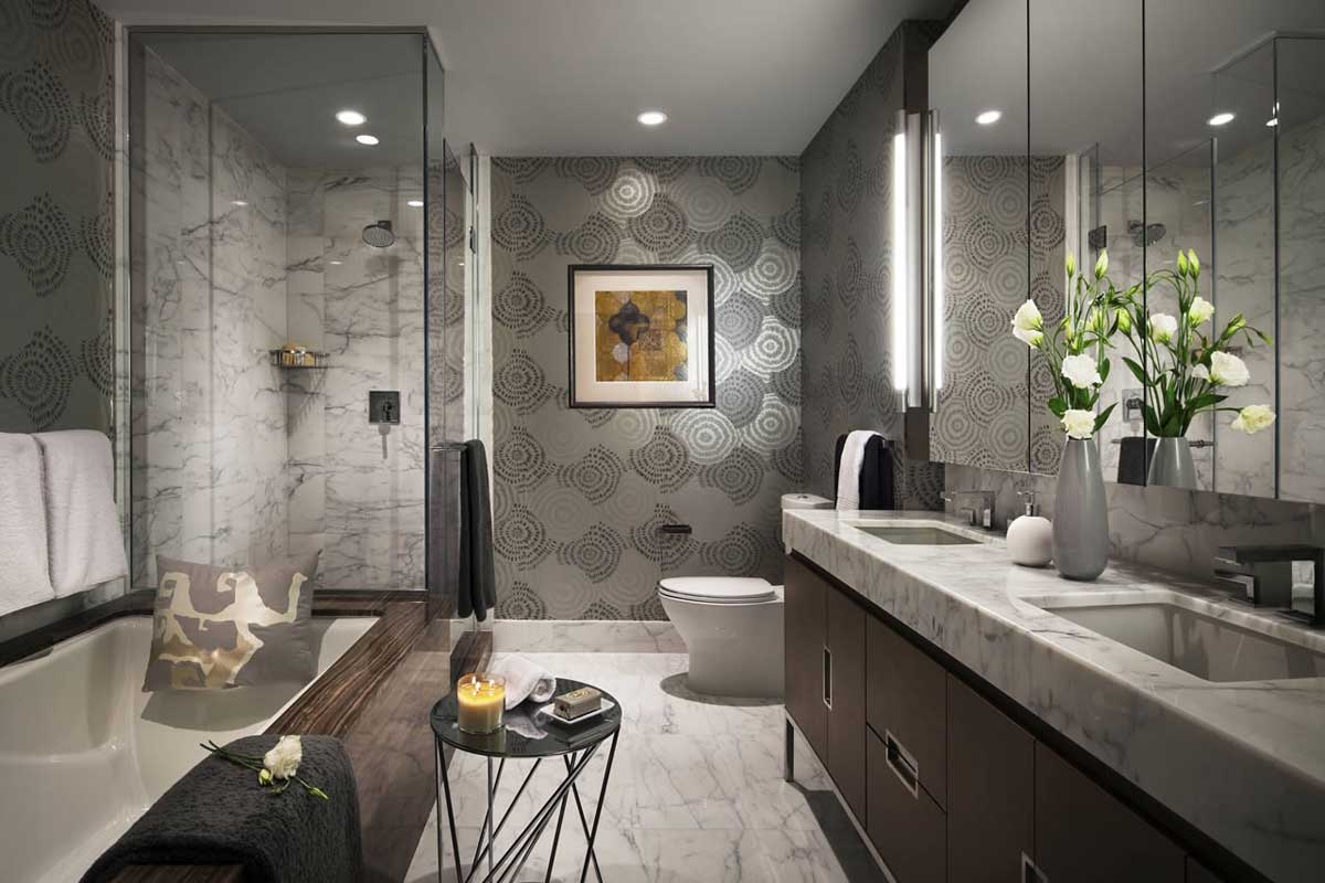 gray bathroom with recessed lighting and wall sconces