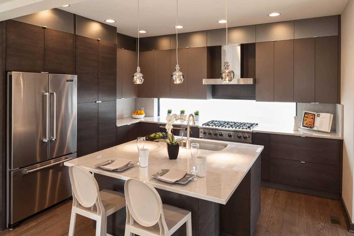 small gray kitchen with chrome mini pendant lights