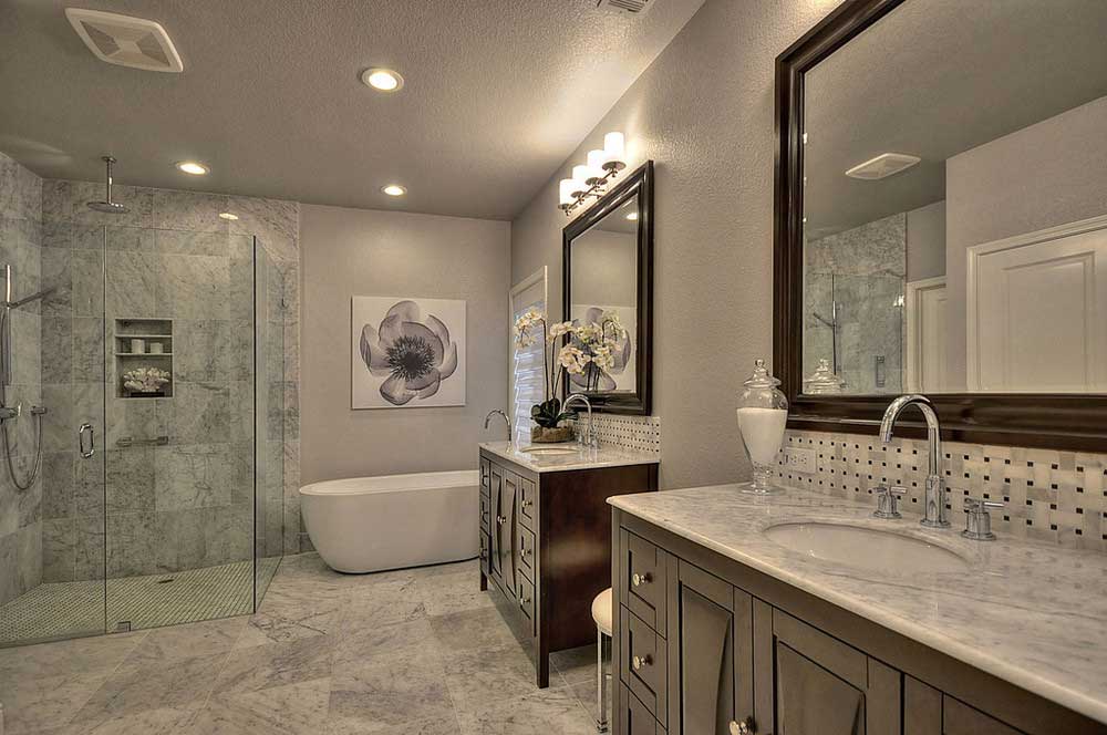 master bathroom with wall sconce light fixtures