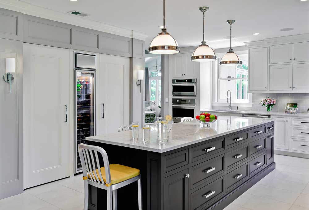 black white kitchen with satin nickel pendant lights