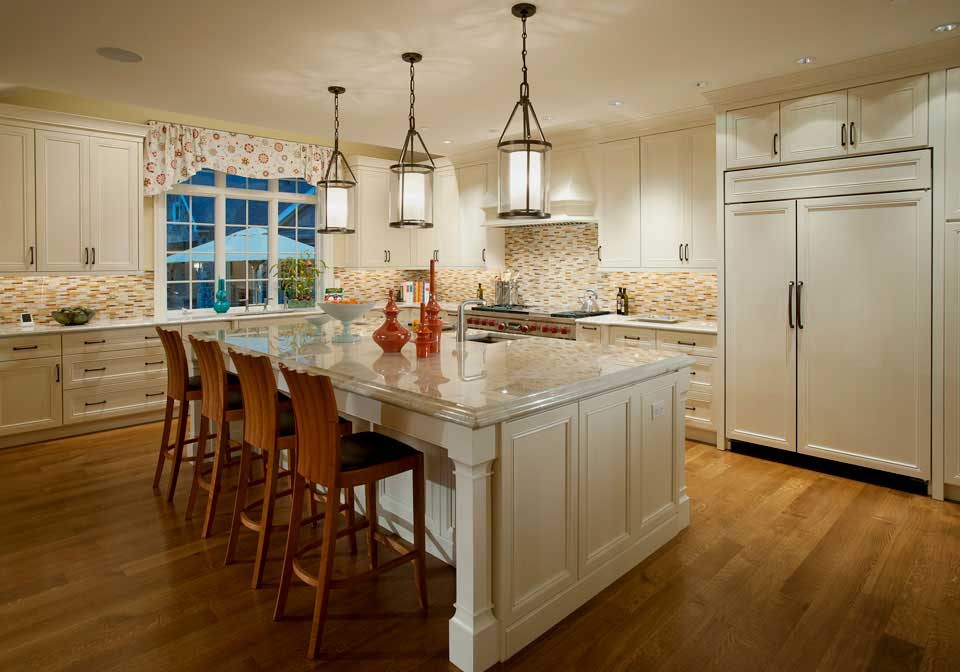 white kitchen with large cylinder pendant lights