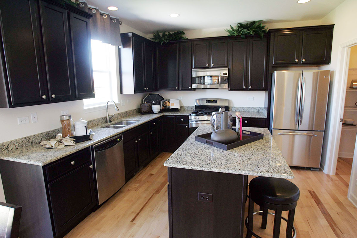 Santa ecilia granite countertops with black cabinets