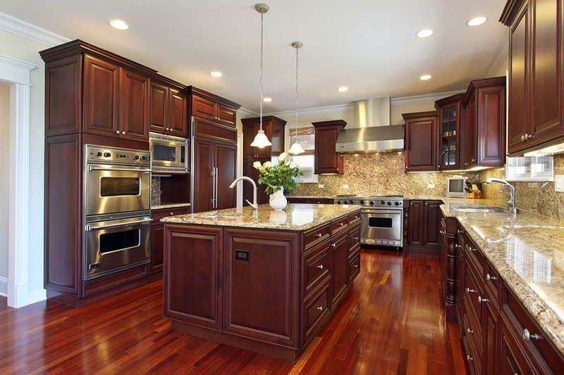 Santa cecilia granite countertops with cherry kitchen cabinets