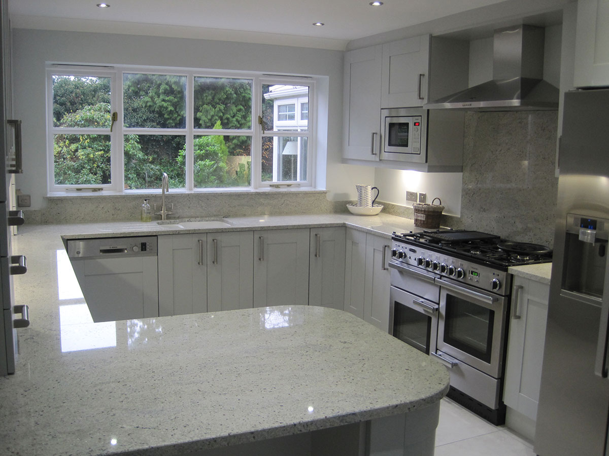 Small kitchen with kashmir white granite countertops