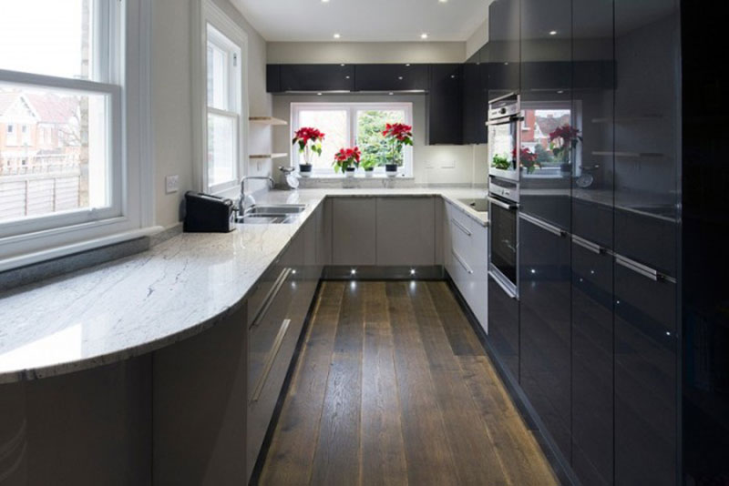 Galley kitchen with river white granite countertops