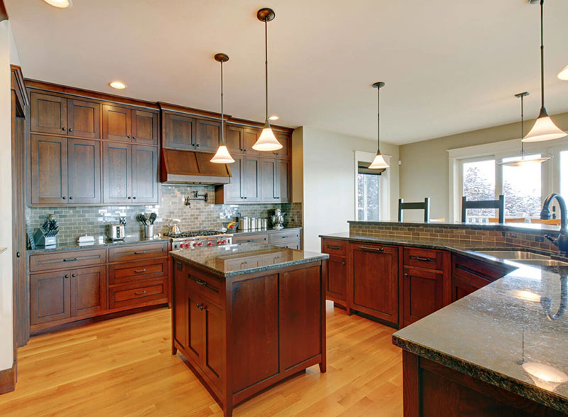 Tan brown granite countertops with dark cabinets