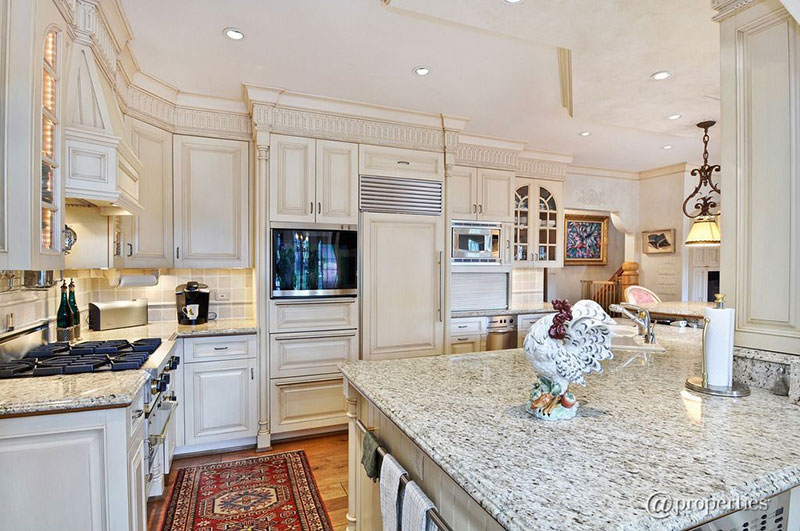 Traditional kitchen with Kashmir white granite countertops