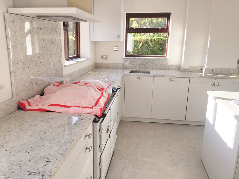 Small kitchen with colonial white granite