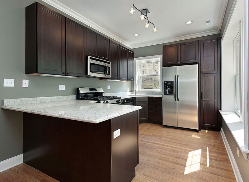 Brown kitchen with Kashmir white countertops