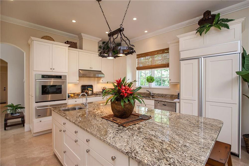 White kitchen with bianco antico countertops