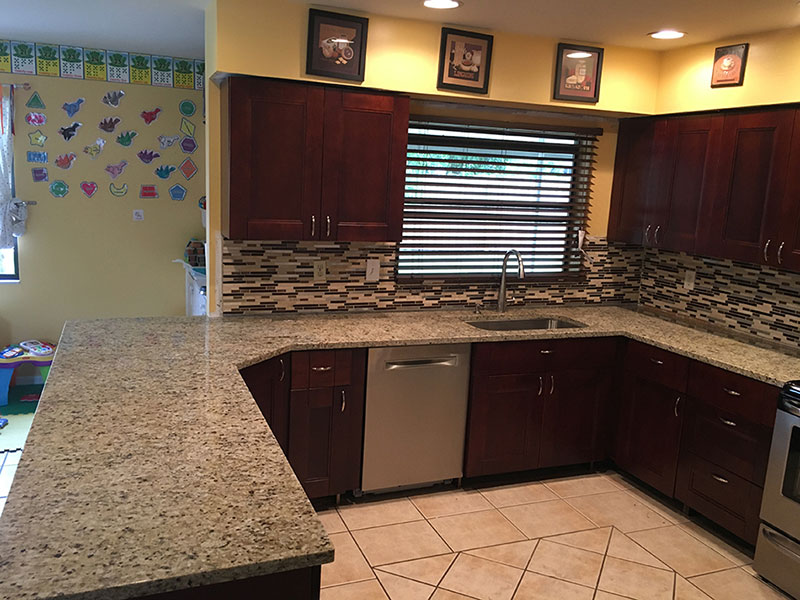 Giallo ornamental granite with subway tile backsplash