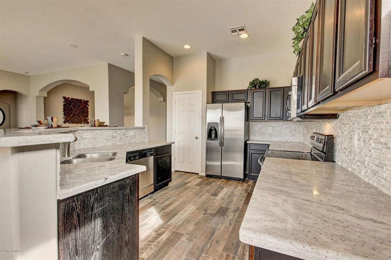 Traditional kitchen with river white granite