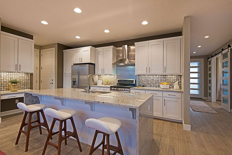 White kitchen with white ice granite