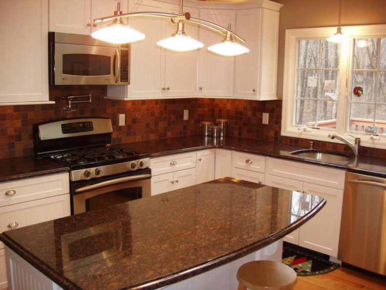 Tan brown granite countertops and backsplash