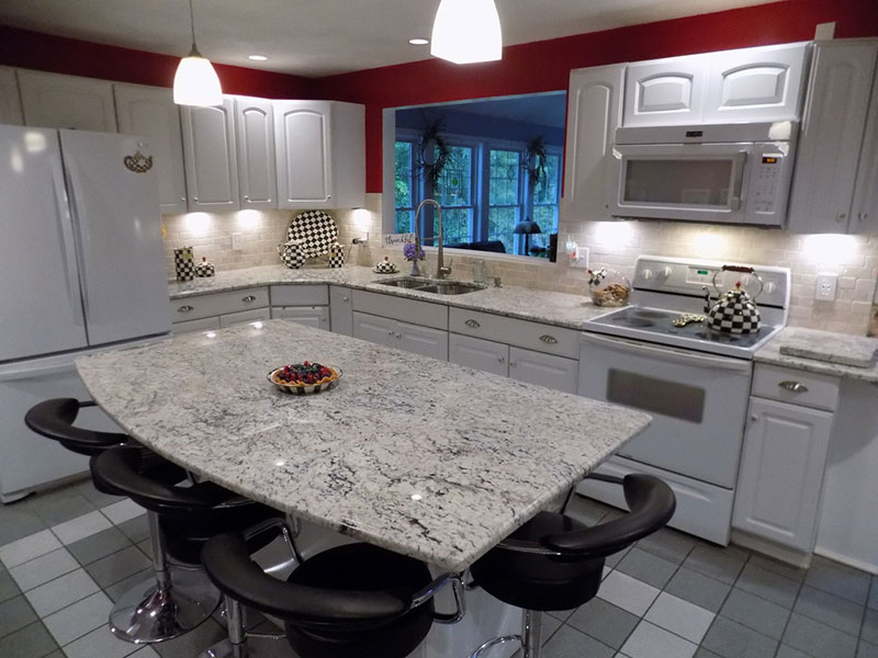 bianco romano granite countertops with white cabinets