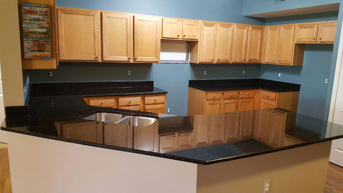 Uba tuba granite and maple cabinets