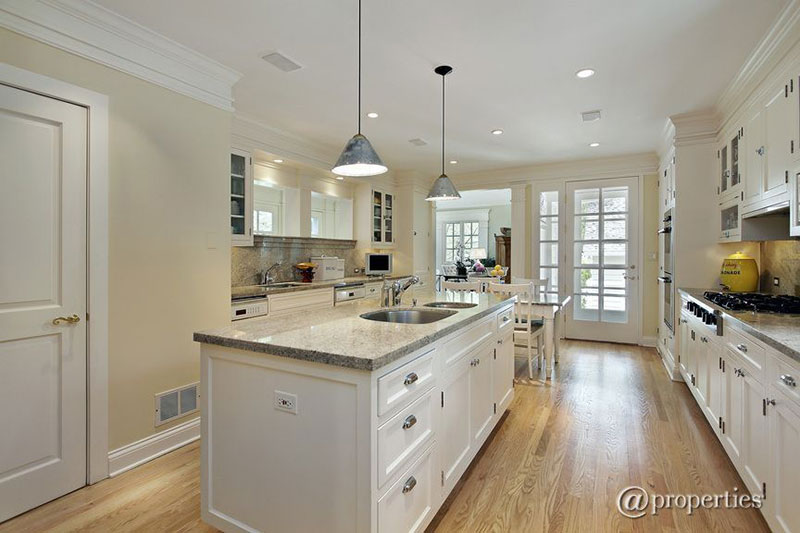 White kitchen with Kashmir white granite countertops