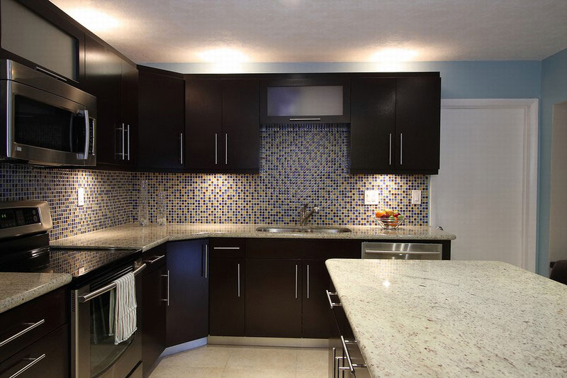 Contemporary kitchen with colonial white countertops