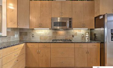 Modern kitchen with new caledonia granite countertops
