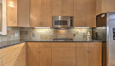 Modern kitchen with new caledonia granite countertops