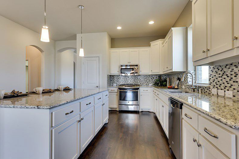 Kashmir white granite countertops with backsplash