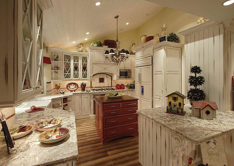 Bianco antico granite countertops with cream cabinets