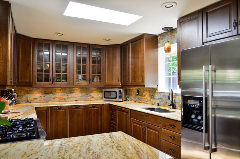 New venetian gold granite countertops with tile backsplash