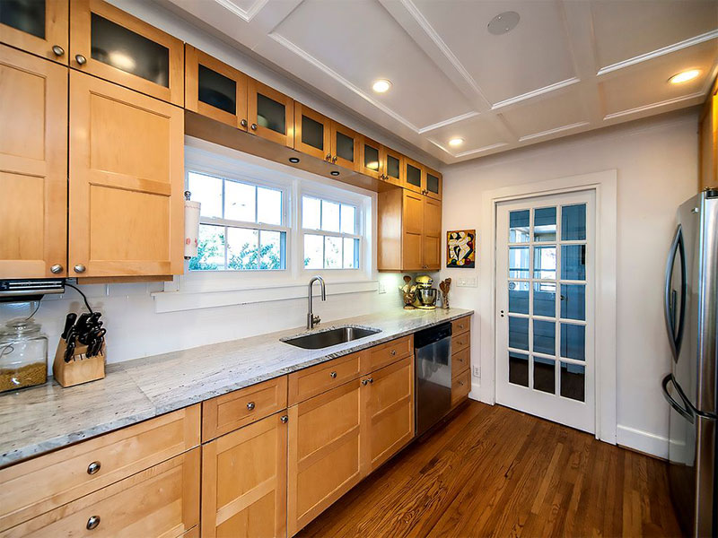 Maple cabinets with river white granite