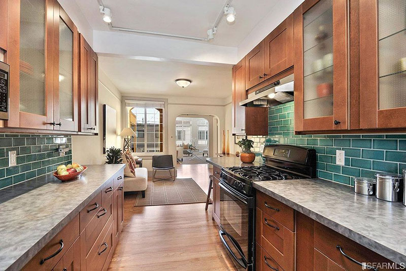 Cherry cabinets with tile backsplash and white ice granite