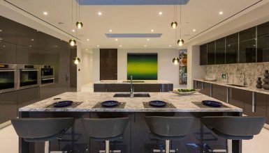 Modern kitchen with river white granite countertops