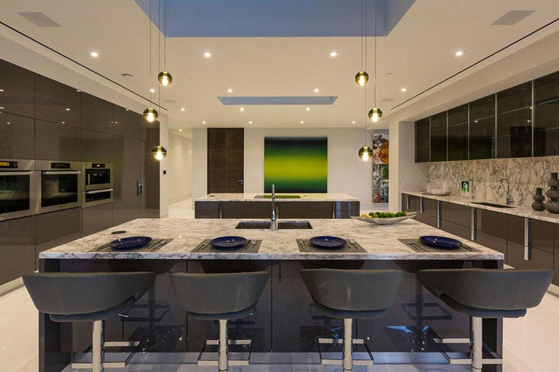 Modern kitchen with river white granite countertops