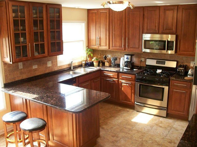 Tan brown granite countertops with wood cabinets