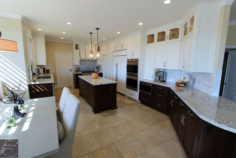 Dark kitchen cabinets with colonial white granite countertops