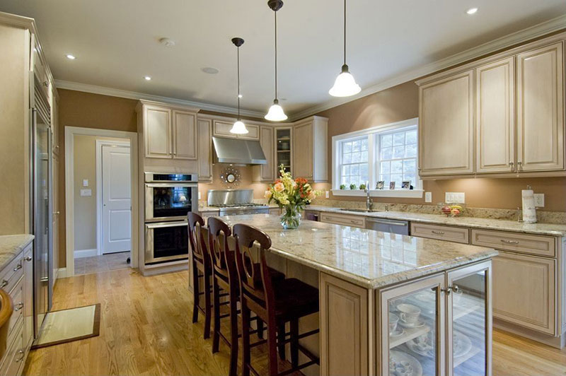 Cream cabinets with river white granite