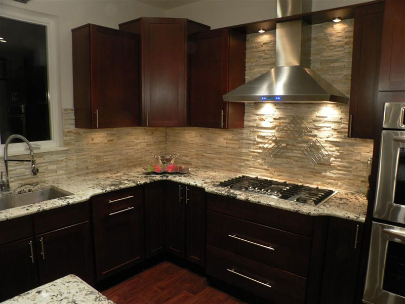 Bianco antico granite countertops with dark cabinets