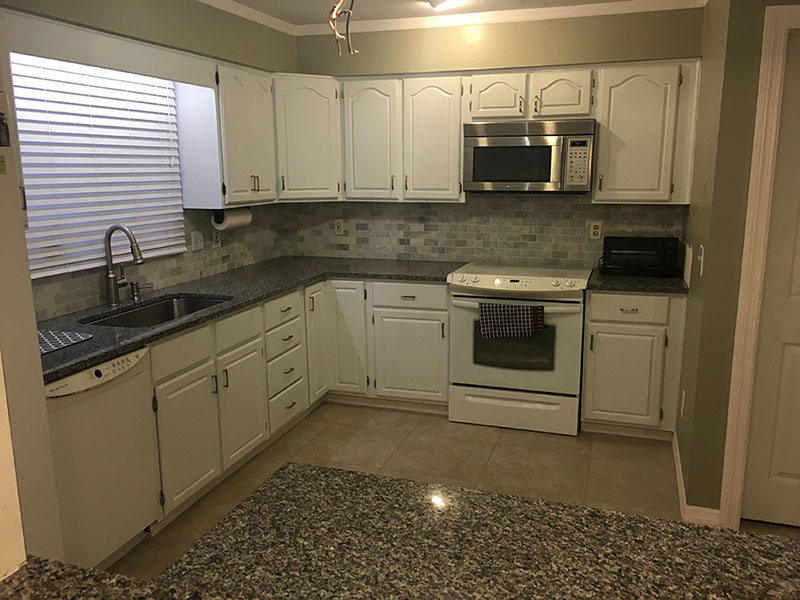 Small kitchen with new caledonia granite countertops