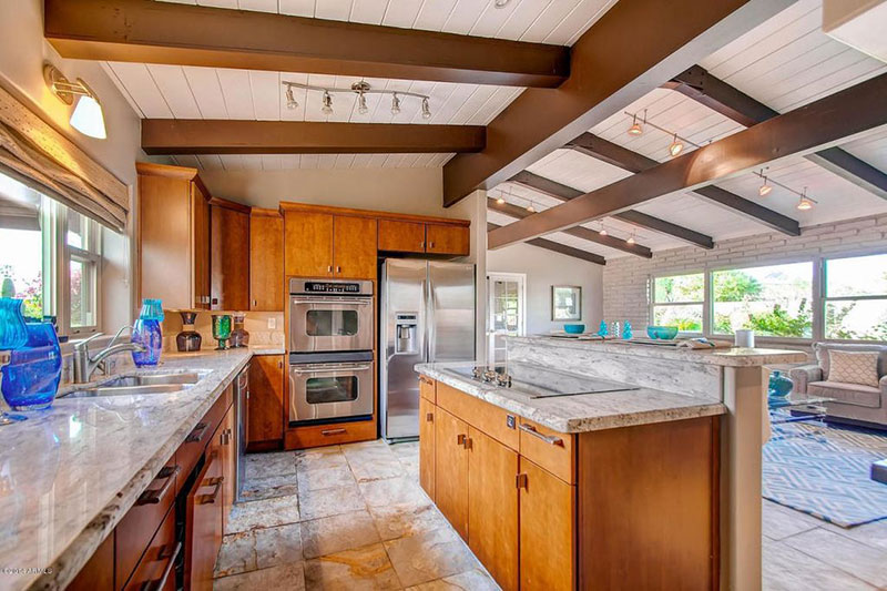 Open plan kitchen with new river white granite