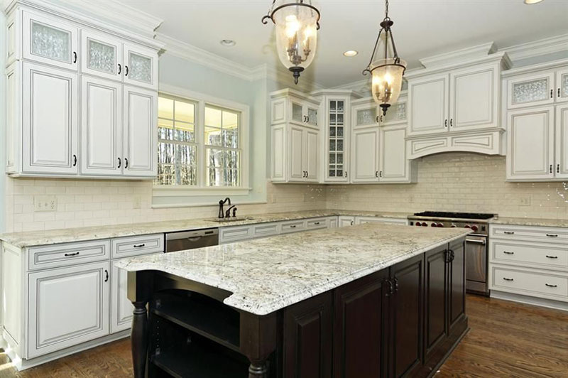 Eclectic kitchen with bianco romano granite countertops