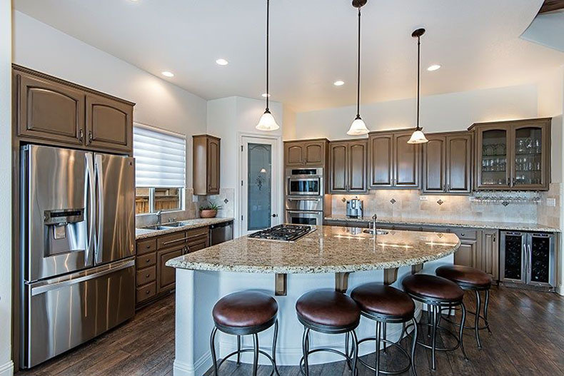 Giallo ornamental granite with gray cabinets