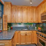 Honey oak cabinets with blue pearl granite
