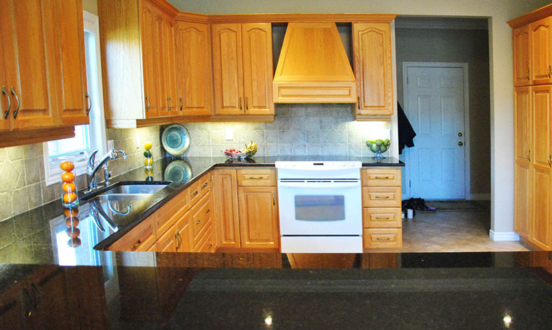 light wood kitchen cabinets with uba tuba granite countertops