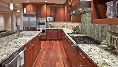 Craftsman kitchen design with bianco antico granite countertops and wood cabinets