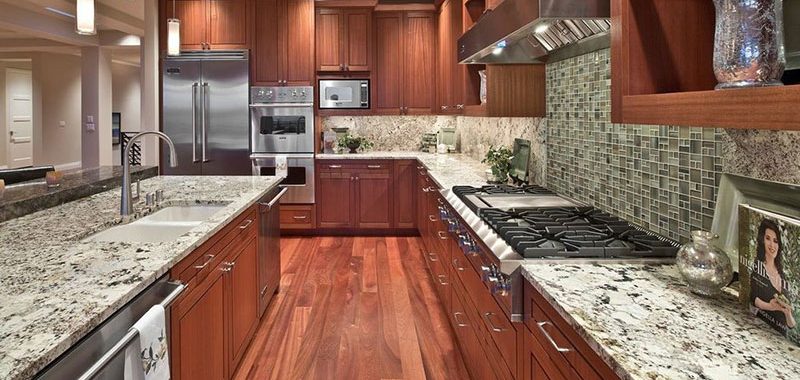 Craftsman kitchen design with bianco antico granite countertops and wood cabinets
