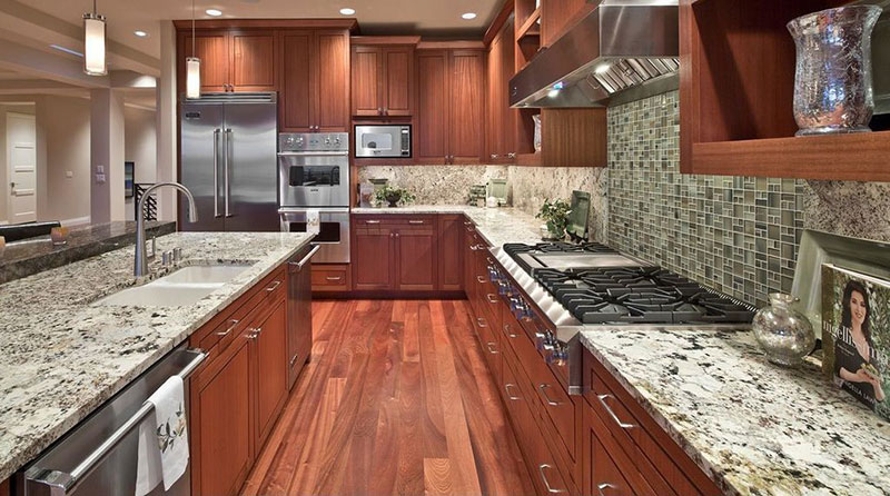 Craftsman kitchen design with bianco antico granite countertops and wood cabinets