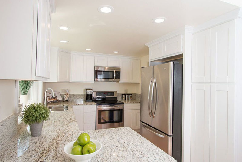 Giallo ornamental light granite white cabinets