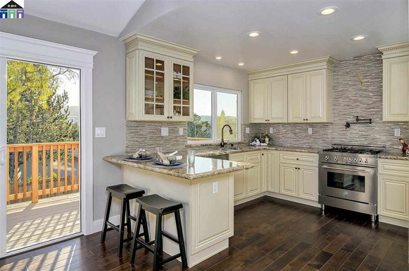 Giallo ornamental granite with cream cabinets