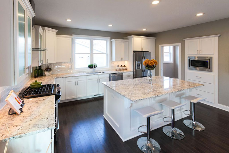 White kitchen with bianco romano granite countertops