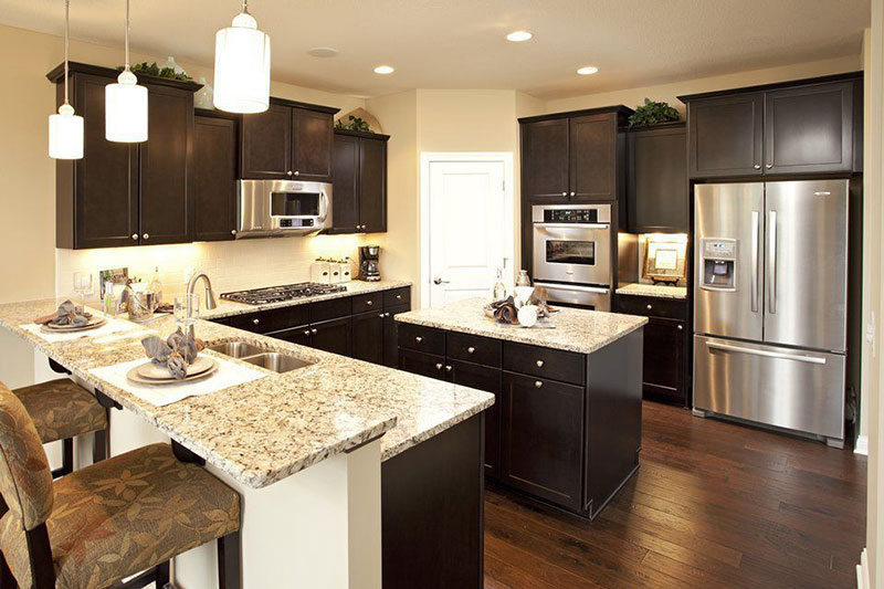 Giallo ornamental granite with black cabinets